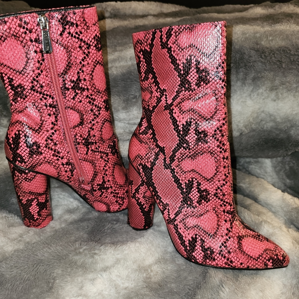 BOOTS Hot pink snakeskin booties.